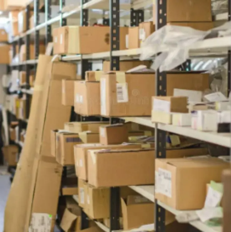 Boxes piled up and overflowing on shelving